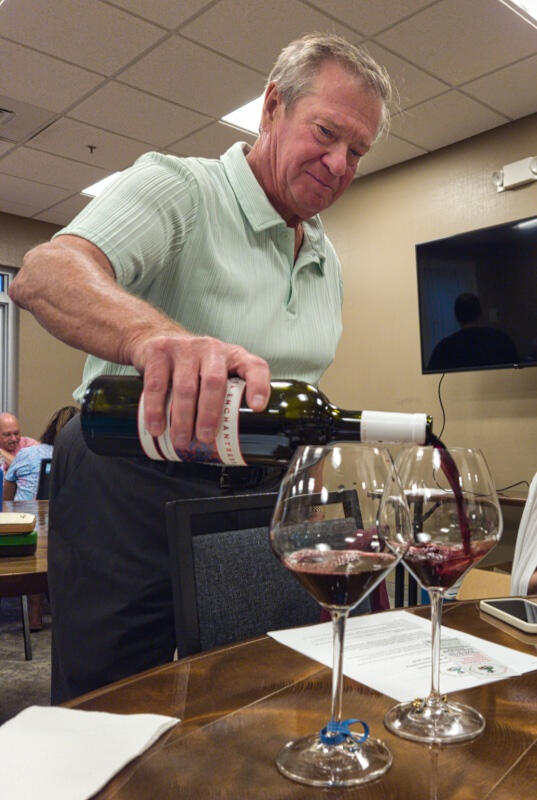 Rich pours Pouring the next wine sample