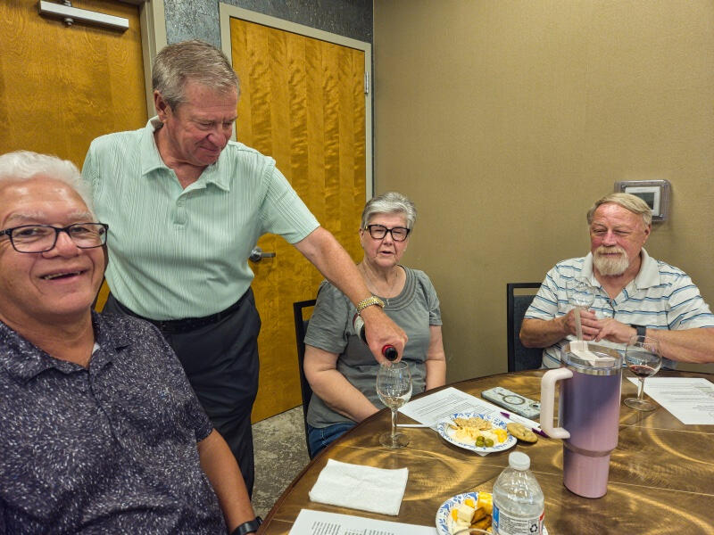 Rich pours a sample of wine